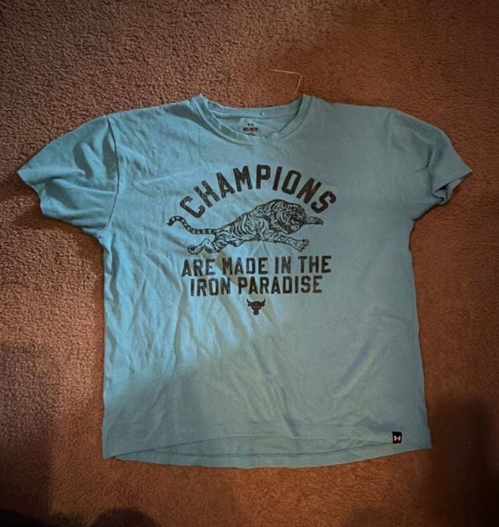 Under Armour Project Rock 'Champions Are Made In The Iron Paradise'  T-Shirt